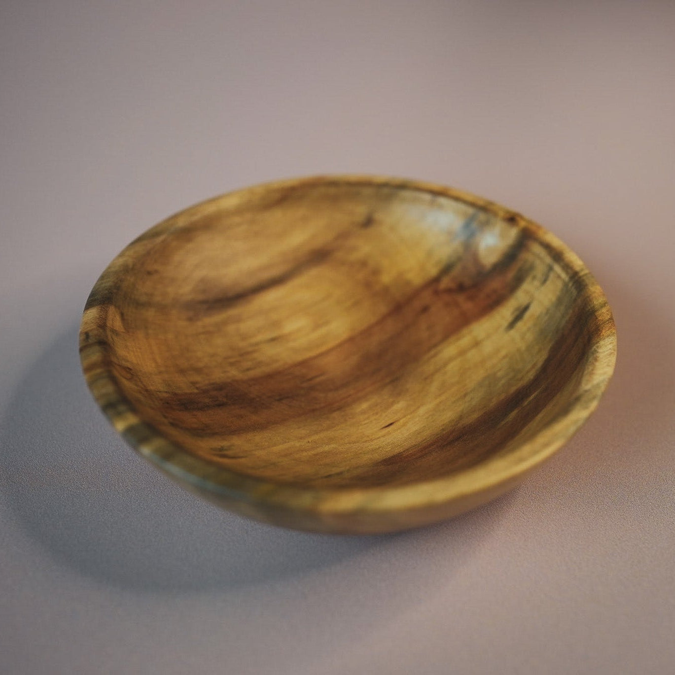 Wooden bowl on a plain background