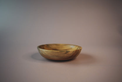 Wooden spalted sycamore bowl on a plain background