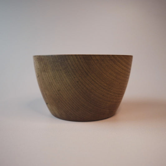 Wooden bowl on a plain background